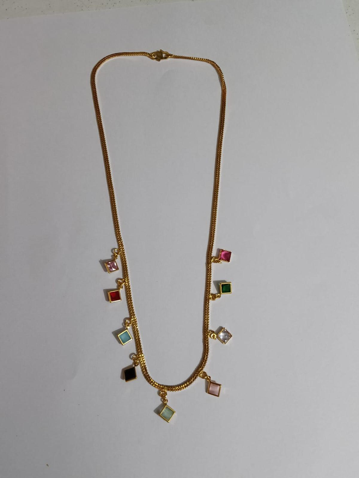 Gold-tone chain necklace with colourful square charms