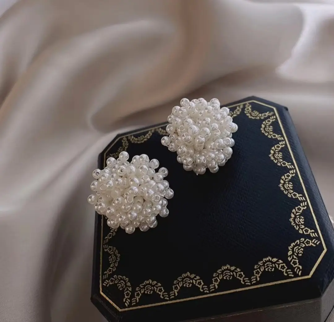 White pearl beaded stud earrings detail
