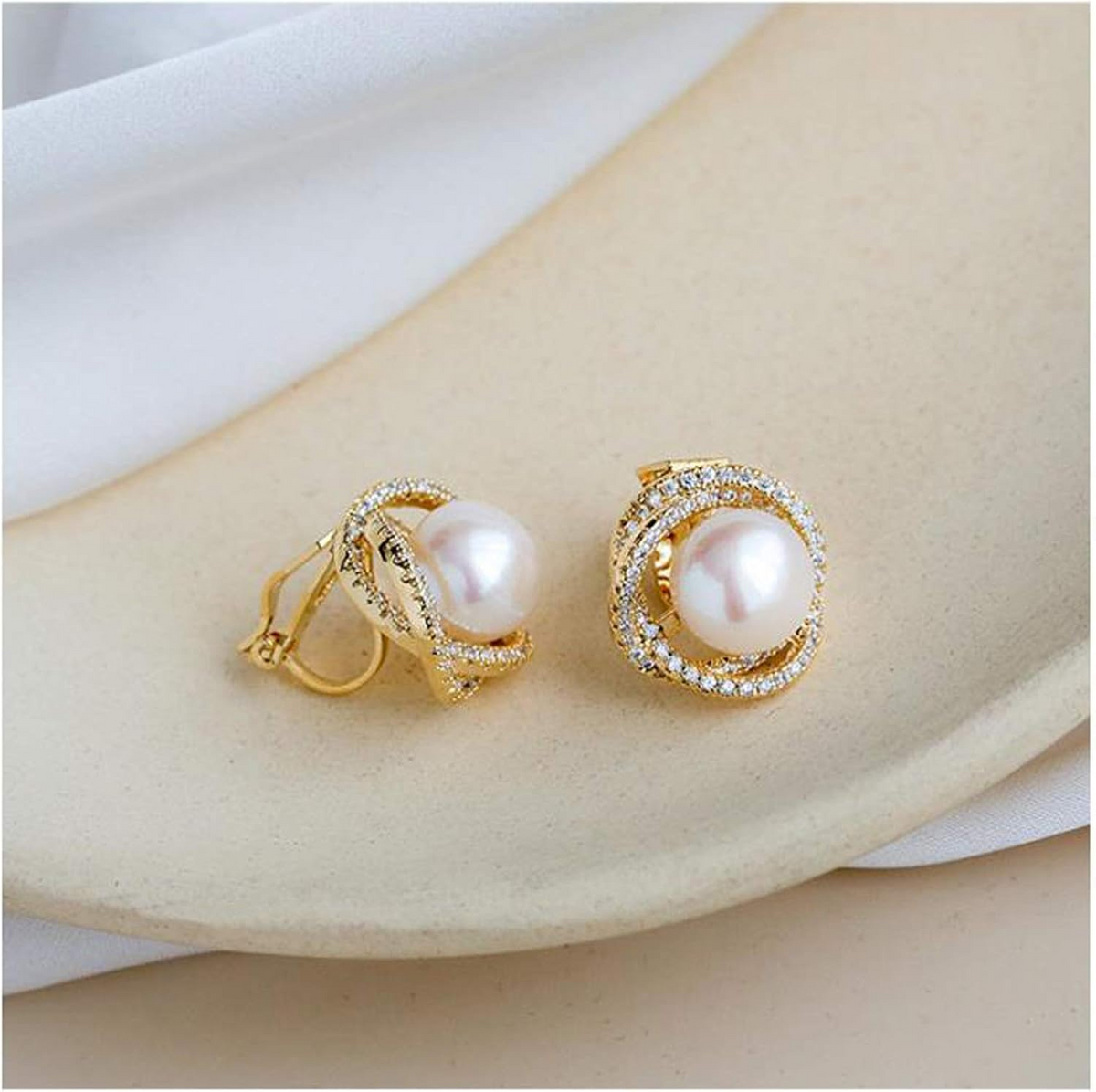 Pearl crystal stud earrings worn close-up
