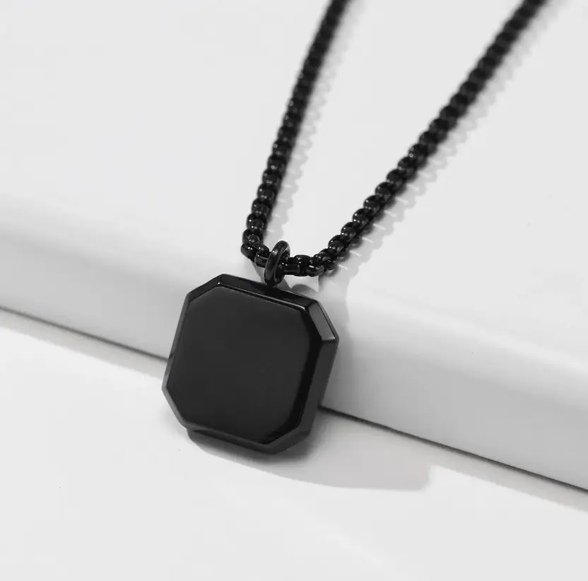 Black geometric pendant necklace on chain