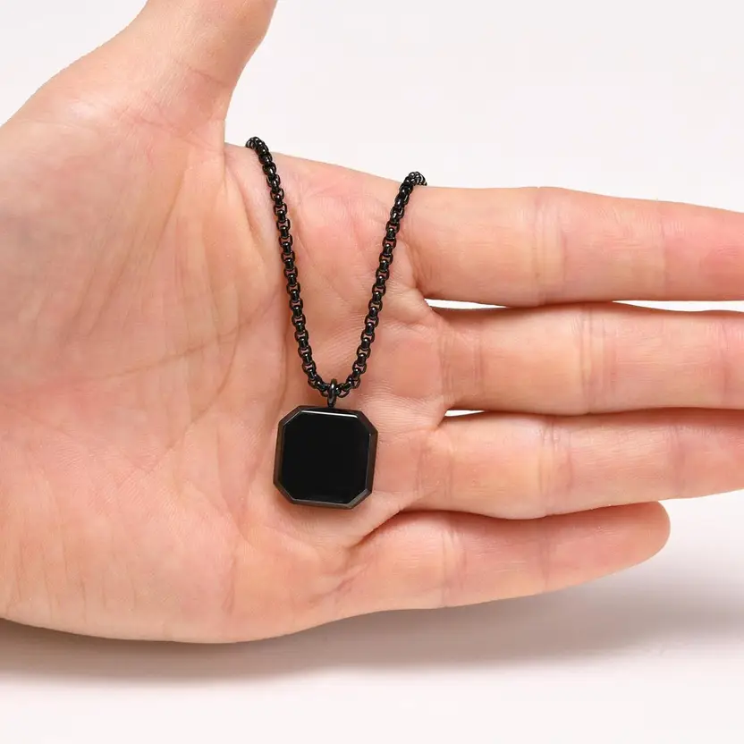 Black geometric pendant necklace detail