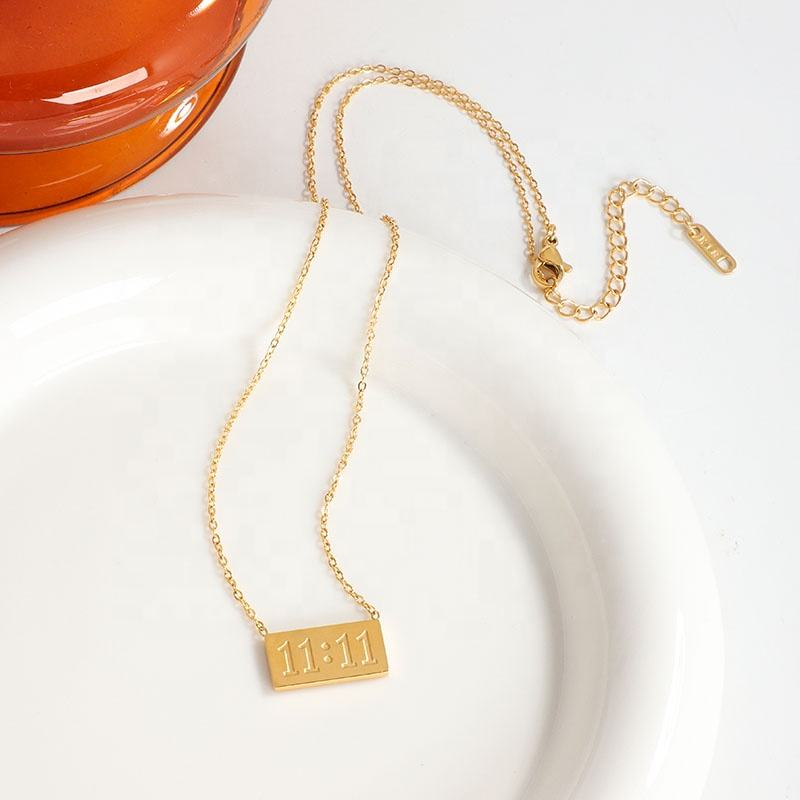 11:11 gold-tone rectangular pendant necklace detail