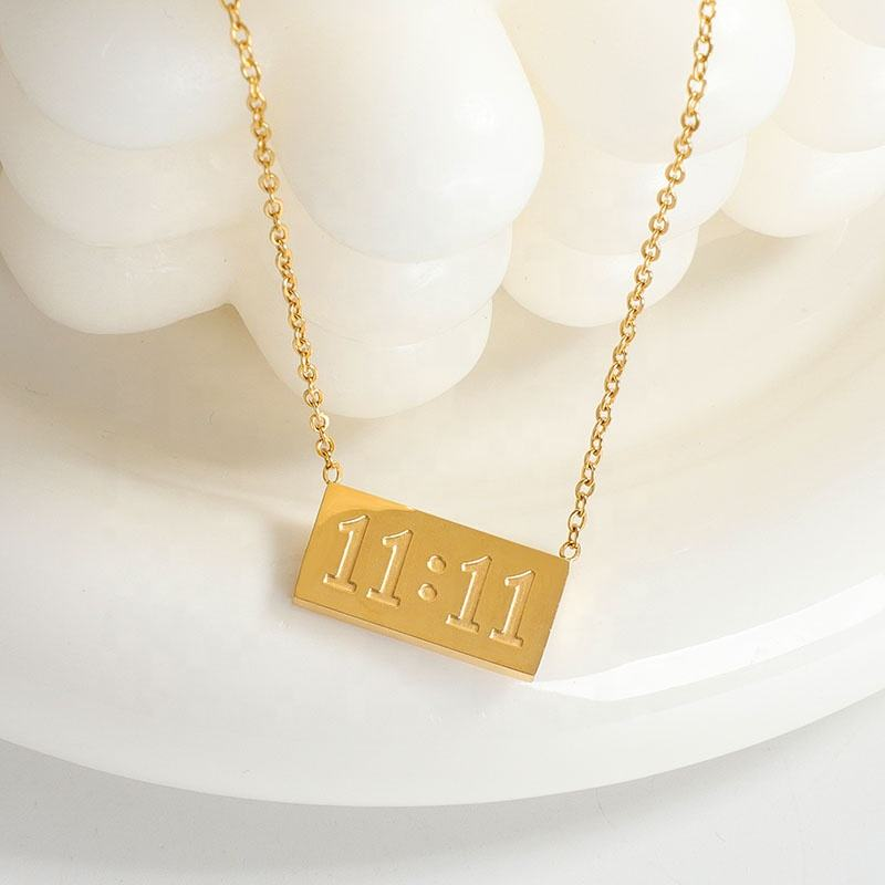 11:11 gold-tone rectangular pendant necklace close-up