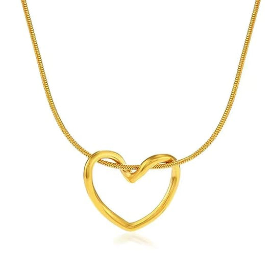 Gold-tone interlocking heart pendant necklace on model