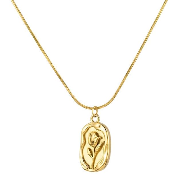 Gold-tone floral pendant necklace on white background