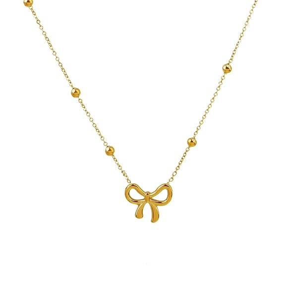 Gold-tone bow pendant necklace with delicate beaded chain