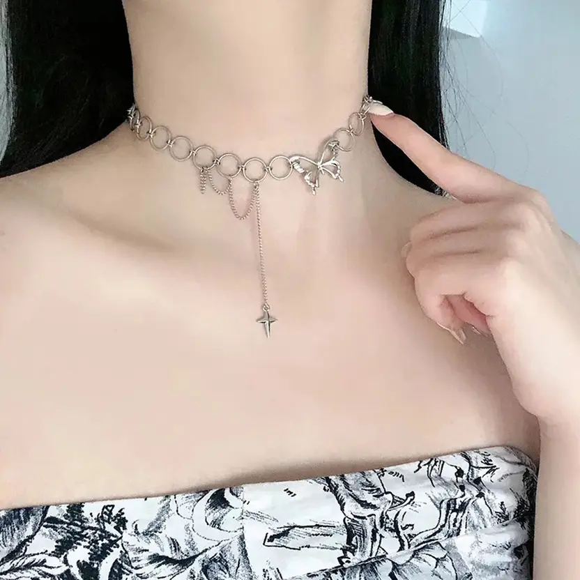 Silver-tone ring link necklace with butterfly charm and star pendant