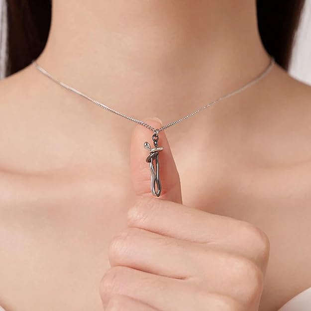 Silver-tone couple pendant necklace worn