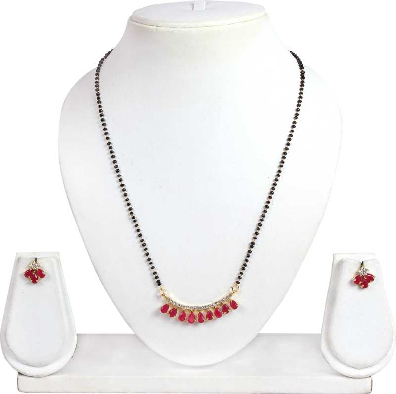 Close-up of red stone mangalsutra necklace pendant and earrings