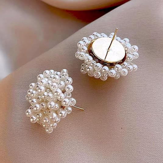 White pearl beaded stud earrings on ear