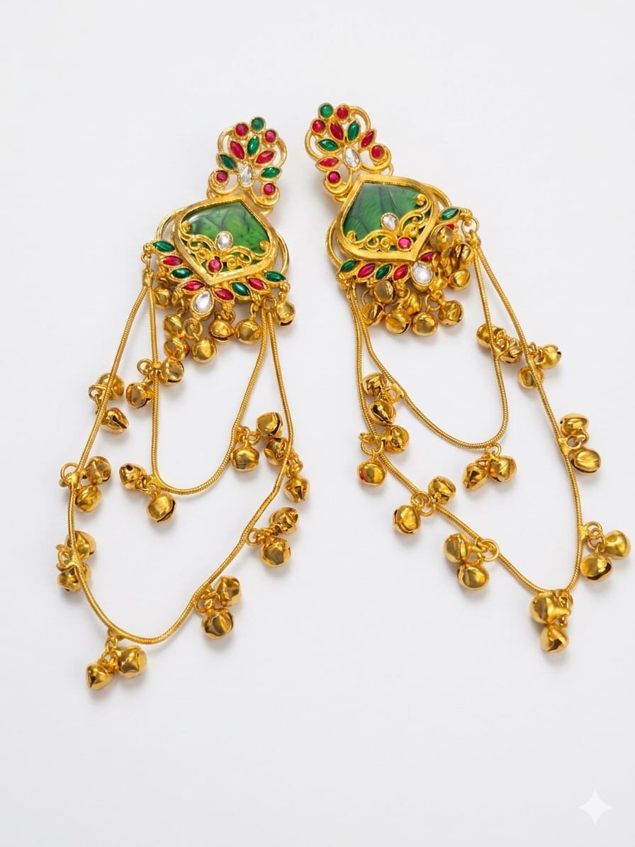 Green red and gold traditional long jhumka earrings displayed on white background