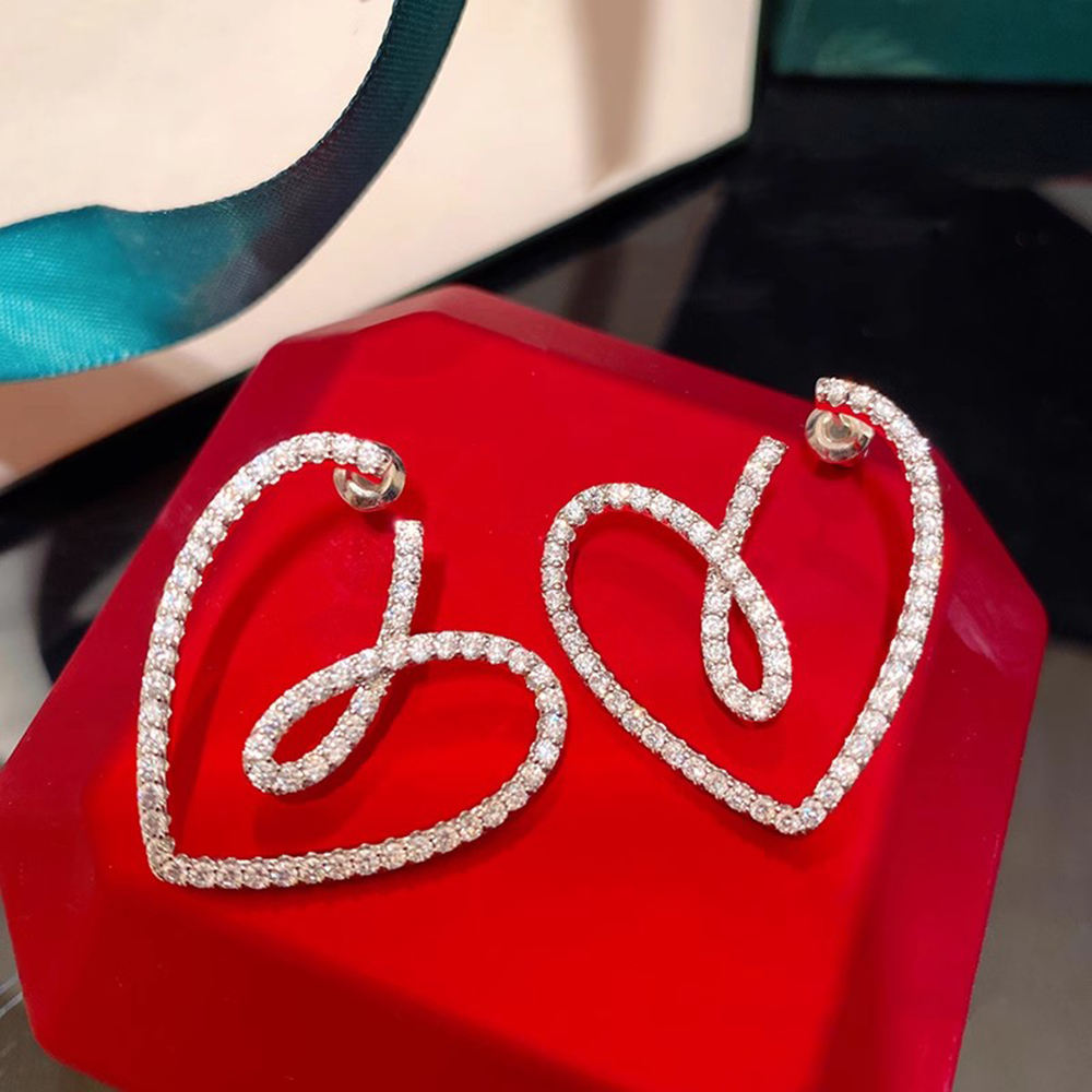 Crystal-pave heart earrings product display