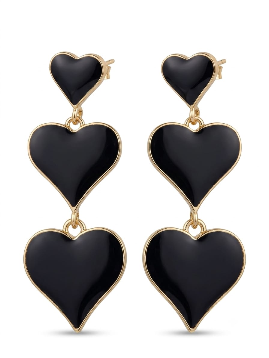 Black heart three-tier drop earrings worn on ear