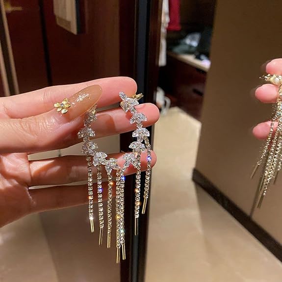 Crystal floral chain tassel earrings worn close-up