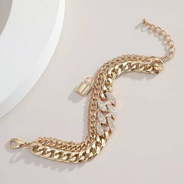 Gold-tone multi-chain bracelet with sparkling leaf centerpiece