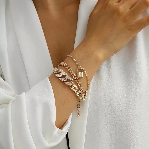 Gold-tone layered chain bracelet worn on wrist