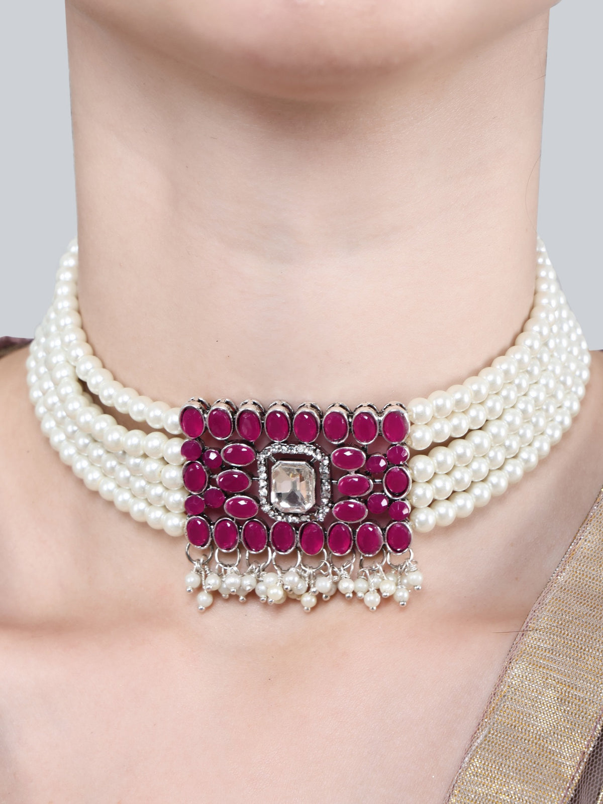 Pearl choker and matching pink stone earrings on model