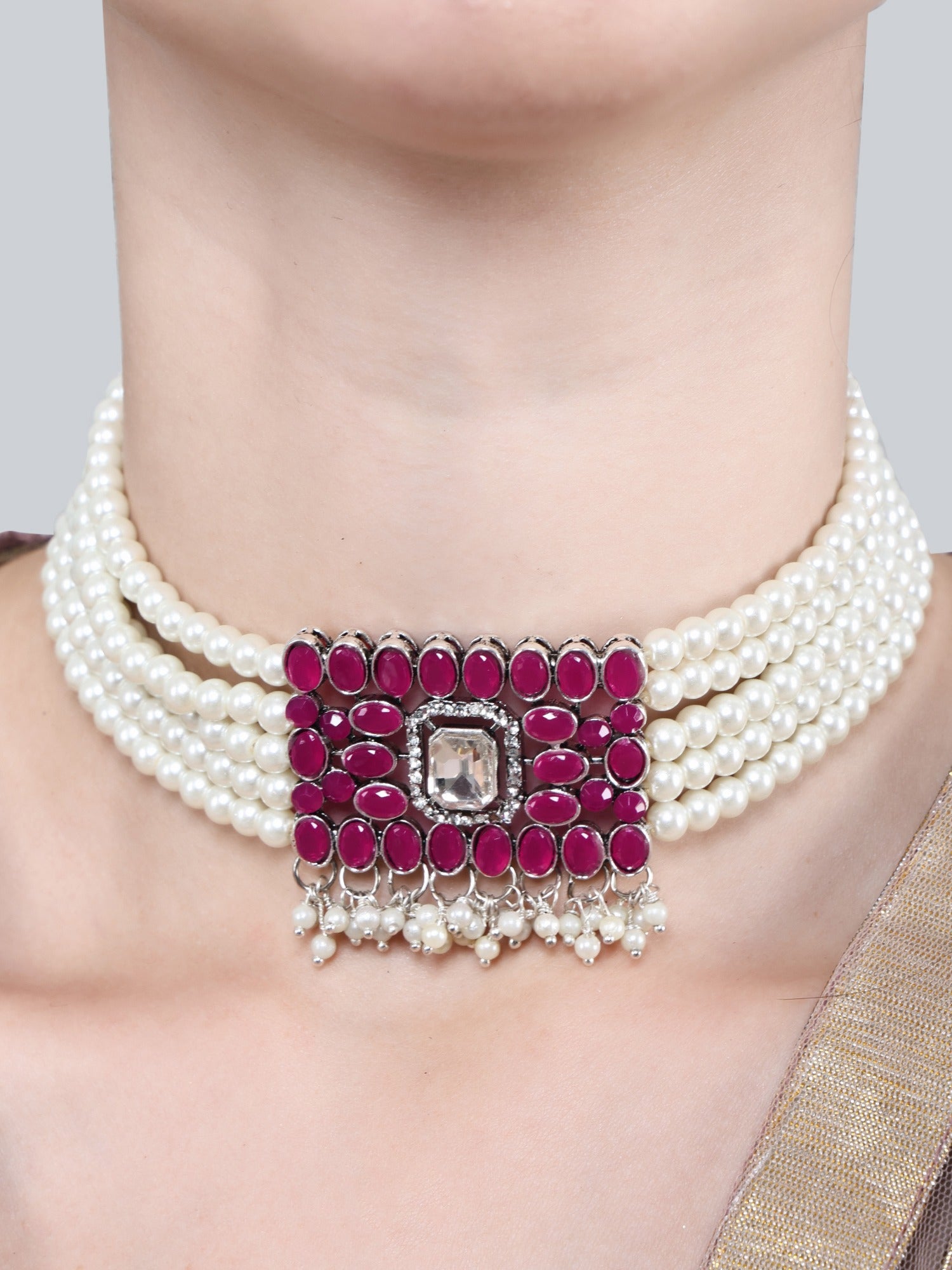 Pearl choker and matching pink stone earrings on model