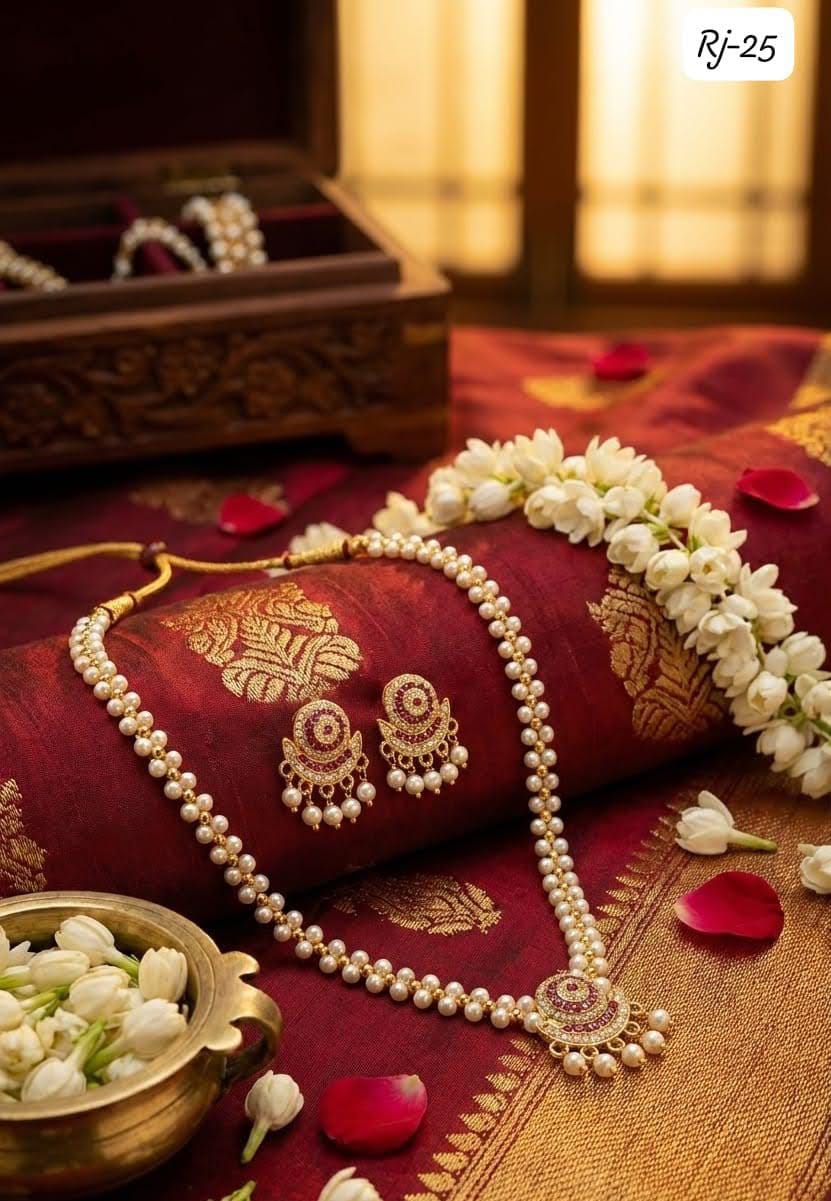 Pearl beaded necklace and matching statement earrings with red and gold detailing