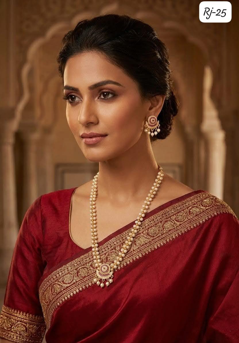 Pearl necklace and matching earrings styled with a red saree