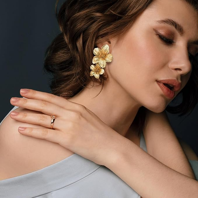 Gold-tone flower dangle earrings close-up